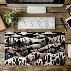 May include: A black and white illustrated desert scene with cacti, mountains, and a starry night sky. The design is printed on a rectangular mouse pad.