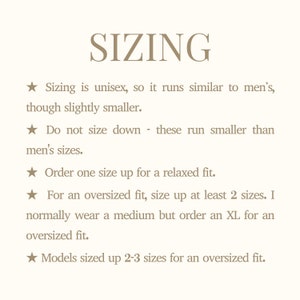 May include: Cream-colored graphic with the word "SIZING" in a serif font. Text below advises on sizing, stating it's unisex, runs smaller than men's, and to size up for a relaxed or oversized fit.