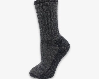 May include: A mid-calf crew sock in a dark charcoal grey heathered knit fabric. The sock features a ribbed texture along the leg, a reinforced heel section, and a smooth toe area, showcasing a consistent speckled appearance throughout the material.
