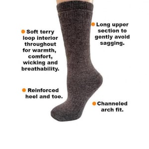 May include: Gray crew socks with a soft terry loop interior, reinforced heel and toe, and a channeled arch fit. The socks have a long upper section to prevent sagging.