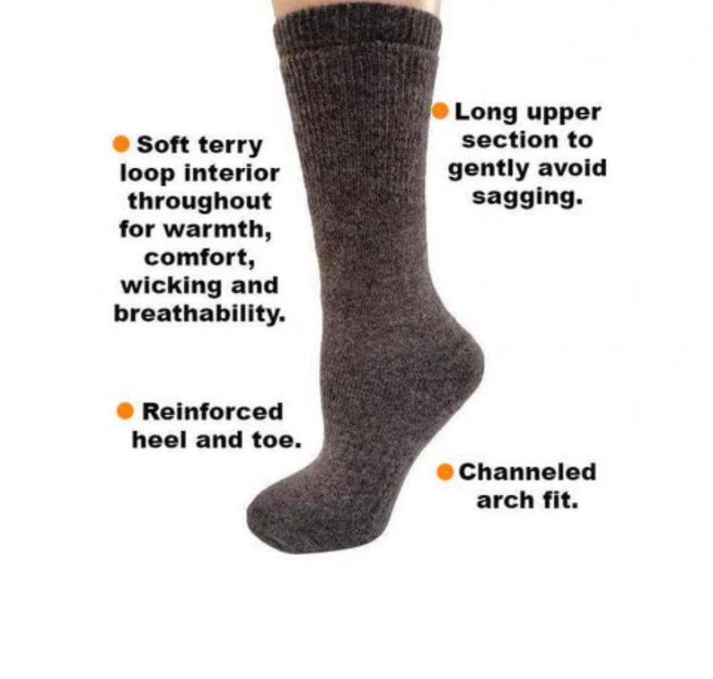 May include: Gray crew socks with a soft terry loop interior, reinforced heel and toe, and a channeled arch fit. The socks have a long upper section to prevent sagging.