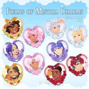 May include: A selection of glitter epoxy charms, each showcasing a portrait of a person within a heart-shaped floral frame. The charms are 6cm in size and feature diverse characters with varied hairstyles and skin tones. The text "FIELDS OF MISTRIA CHARMS" is at the top.