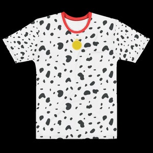 May include: White t-shirt with a dalmatian spot pattern. The shirt has a red collar and a gold pendant. The black spots are irregularly shaped and scattered across the shirt's surface. The shirt is a crew neck style.