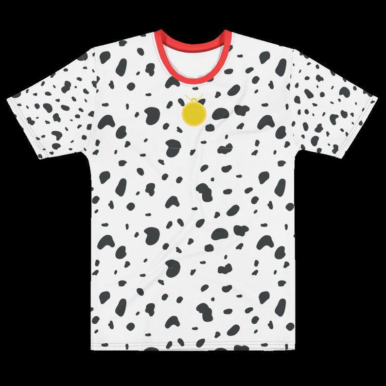 May include: White t-shirt with a dalmatian spot pattern. The shirt has a red collar and a gold pendant. The black spots are irregularly shaped and scattered across the shirt's surface. The shirt is a crew neck style.