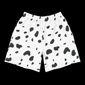 May include: White shorts with a black Dalmatian spot pattern. The shorts have an elastic waistband and a relaxed fit. The fabric appears to be lightweight and suitable for warm weather. The shorts are designed for casual wear.