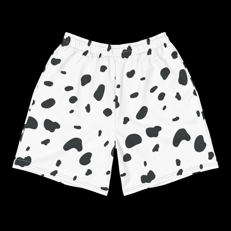 May include: White shorts with a black Dalmatian spot pattern. The shorts have an elastic waistband and a relaxed fit. The fabric appears to be lightweight and suitable for warm weather. The shorts are designed for casual wear.