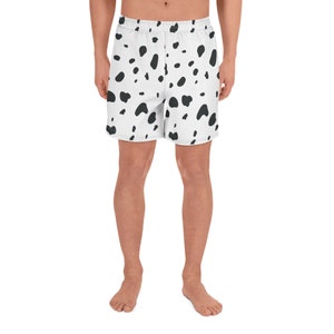May include: White athletic shorts with a black dalmatian spot pattern. The shorts have an elastic waistband and a relaxed fit. The shorts are made of a lightweight, breathable fabric, perfect for workouts or casual wear.