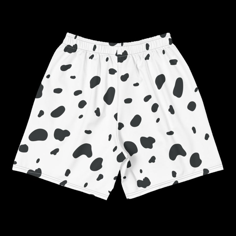 May include: White athletic shorts with a black Dalmatian spot pattern. The shorts have an elastic waistband and a relaxed fit, suitable for various activities. The fabric appears to be lightweight and breathable.