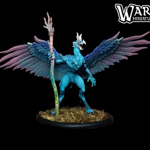 May include: A detailed miniature figure of a mythical creature with blue skin, large wings with blue and purple feathers, and a staff. The figure stands on a small, round base with a grassy texture. The figure is from Warp Miniatures.