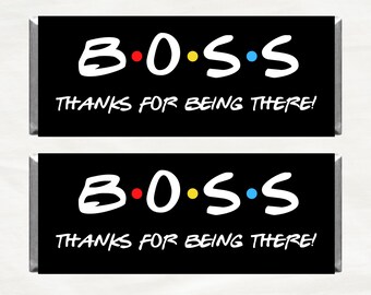 May include: Two black candy bar wrappers with the word "BOSS" in white, with colored dots, and the phrase "THANKS FOR BEING THERE!" in white. The wrappers are rectangular.