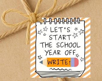May include: A gift tag with the message "LET'S START THE SCHOOL YEAR OFF WRITE!" in black text, with a pencil illustration. The tag is decorated with stars and orange stripes, tied with twine.