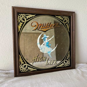 Espejo vintage de Miller High Life de los años 70 con una chica en la luna enmarcada (35,5 x 35,5 cm)