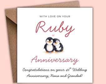 May include: A white greeting card with a brown envelope. The card features the words "Ruby Anniversary" in pink script, with a watercolor illustration of two penguins. Text reads "Congratulations on your 40th Wedding Anniversary, Nana and Grandad!"