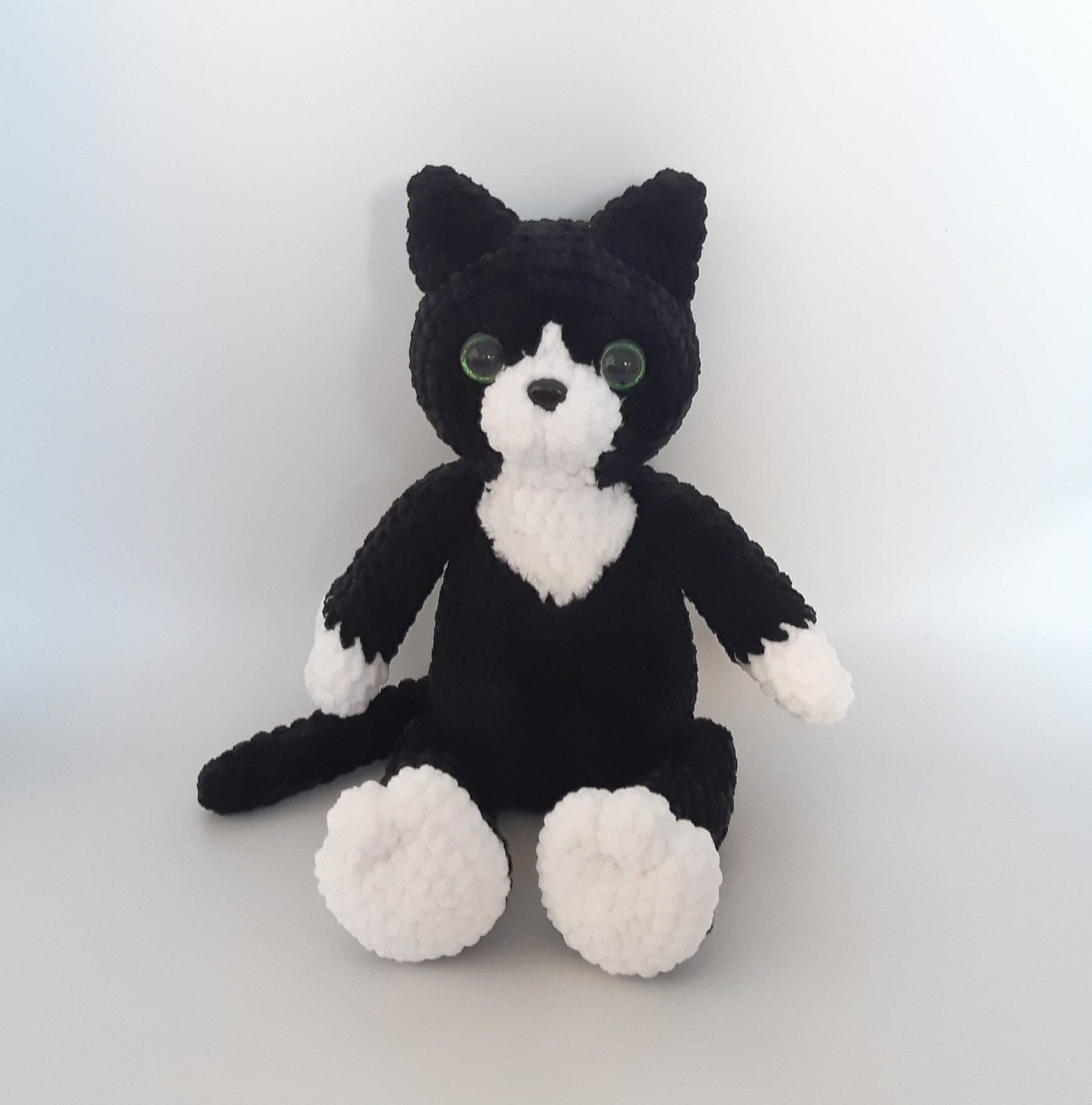 stuffed black and white cat