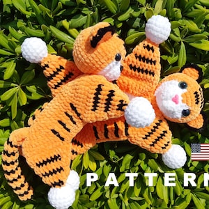 Carino modello di tigre coccolona all'uncinetto. Modello di coperta con peluche a forma di animale. Modello di tigre all'uncinetto.