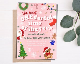 Puede incluir: Invitación rosa de temática navideña con el texto "the most ONEderful time of the year" y "Olivia Turning One!" con detalles para una fiesta el 10 de diciembre a las 2:00 PM. La invitación presenta ilustraciones de Papá Noel, un árbol de Navidad, un hombre de jengibre, una media, una taza de chocolate caliente y un oso de peluche.