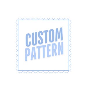 May include: A light blue border with a scalloped edge surrounds the text "CUSTOM PATTERN" in a light blue font.