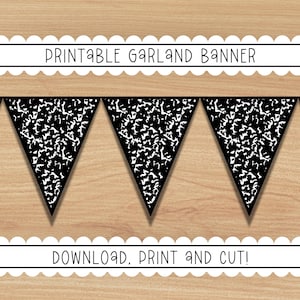 May include: A printable garland banner with black and white notebook paper pattern pennants. The banner includes the text "PRINTABLE GARLAND BANNER" and "DOWNLOAD, PRINT AND CUT!" on a light brown wood grain background.