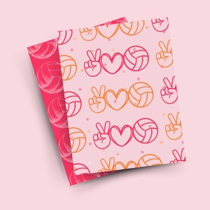 May include: Pink and orange patterned wrapping paper with a repeating pattern of peace signs, hearts, and volleyballs.