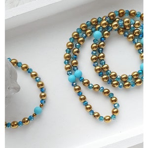 Perlenset Hämatit / Glas 8mm gold/blau