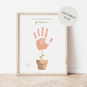 May include: A framed print with a handprint design, resembling a flower. The print includes the text "HAPPY MOTHER'S DAY gram" in green, with the name "Josie" and the year "202X" at the bottom. A circular graphic says "EDITABLE FILE!"