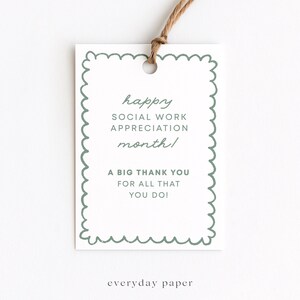 May include: A white gift tag with a scalloped green border and a brown string. The tag reads "happy SOCIAL WORK APPRECIATION month! A BIG THANK YOU FOR ALL THAT YOU DO!" The text "everyday paper" is at the bottom.