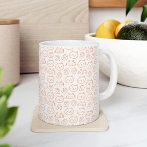 Cute Orange Hand Drawn Cat Face Pattern Ceramic Mug | Adorable Coffee Cup for Cat Lovers, Perfect Gift for Birthdays