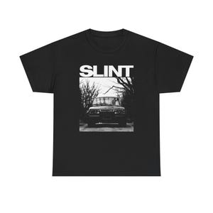 May include: Black t-shirt with the word "SLINT" in white block letters above a black and white image of a vehicle on a road lined with trees. The t-shirt is made of a soft, comfortable material.