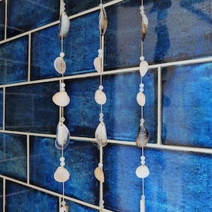 Cockle, mussel and razor clam shell beaded triple string mobile/windchime.