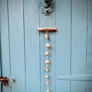 Cockle shell and driftwood beaded single string mobile.