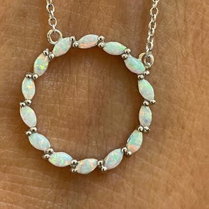 Fire Opal Sterling Silver Circle Pendant Necklace: CZ Accent