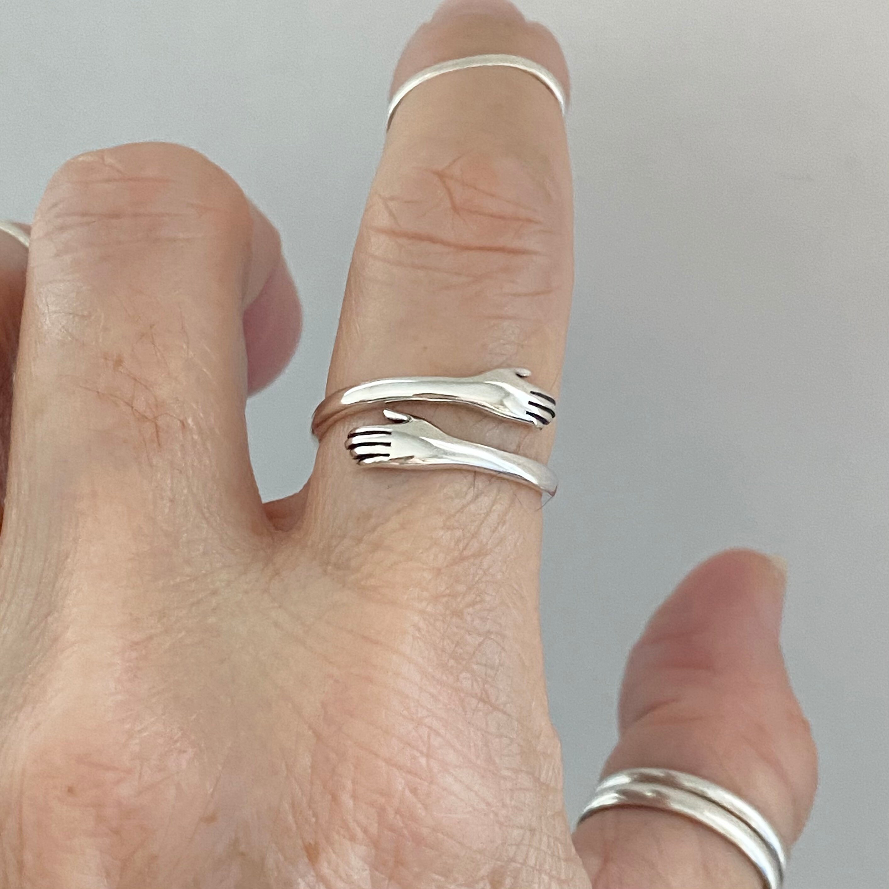 Solid silver hug ring sale