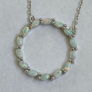Fire Opal Sterling Silver Circle Pendant Necklace: CZ Accent