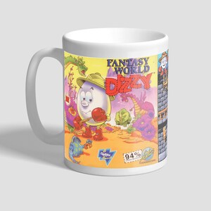 May include: White ceramic mug featuring a colourful illustration of a video game character called Dizzy from the game "Fantasy World Dizzy". The mug displays the game's title and logo, alongside other characters and scenery from the game. This mug would make a great gift for fans of the game.