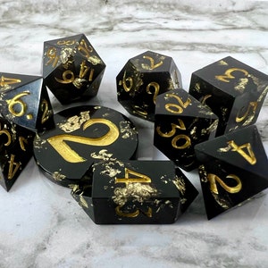 Dark Obelisk - Opaque black base with gold leaf inclusions, handmade sharp edge dice set for RPGs, D&D, Dungeons and Dragons.