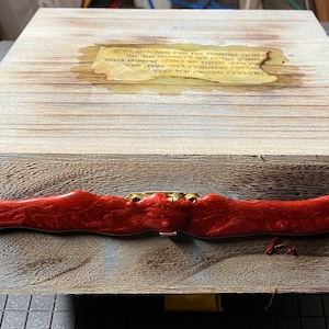 May include: A wooden box with a red wax seal and a gold latch. The box has a label with text that reads "LURRELL BEARD FOR SEN." and "ERA OF GOOD FEELING ENDED.  NOW WE ARE IN AN ERA OF GREAT EXPECTATIONS."