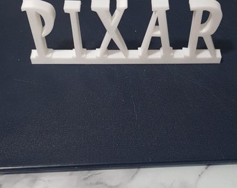 3D printed PIXAR sign logo white
