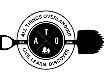 May include: Black and white logo for All Things Overlanding, a company that promotes outdoor adventure. The logo features a shovel, a compass, and the text "All Things Overlanding, Est. 2016, Live. Learn. Discover."