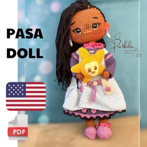 May include: Crochet amigurumi doll pattern for a girl with brown skin, black hair, and a purple and blue dress. She is holding a yellow star-shaped amigurumi toy. The pattern is available as a PDF download. The text "PASA DOLL" is visible in the image.