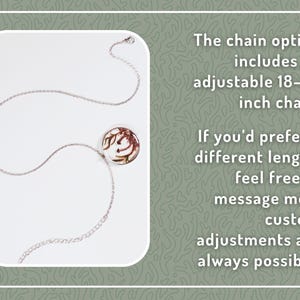 May include: Silver-toned necklace with a circular pendant featuring a brown and cream design. The chain is adjustable, ranging from 18 to 22 inches. The text on the image says custom adjustments are always possible.