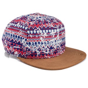 May include: A baseball cap with a brown peak and a patterned crown. The crown features a red, white, and blue geometric design. The cap is angled slightly to the right, showcasing its details.