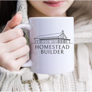 May include: White ceramic mug with a black line drawing of a house and the text "Homestead Builder".