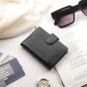 Flat lay of personalised black leather RFID credit card holder wallet for women