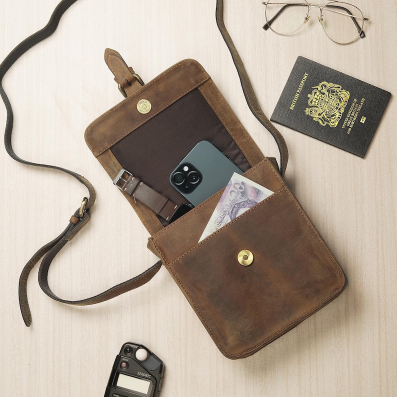 Interior compartments of brown leather satchel