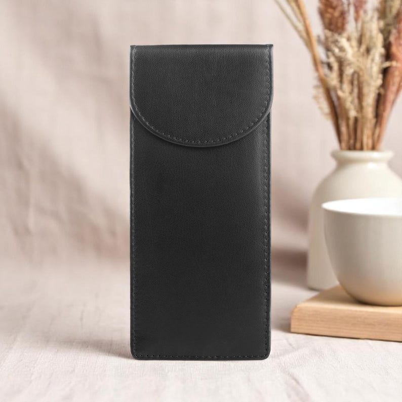 Double black leather glasses case designed to hold two pairs front view