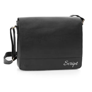 May include: Black leather messenger bag with a white inscription that reads "Script".