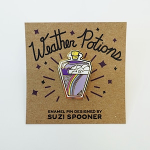 May include: Enamel pin featuring a purple potion bottle with a rainbow and cloud design. The pin is on a brown card with the text "Weather Potions" and "ENAMEL PIN DESIGNED BY SUZI SPOONER".