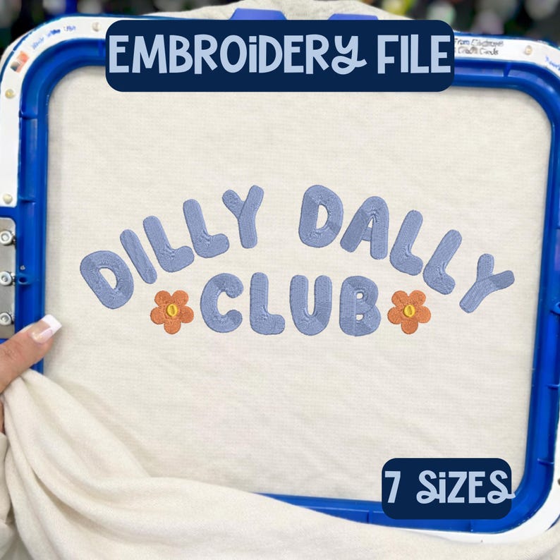 May include: An embroidery file design with the words "DILLY DALLY CLUB" in blue, with orange flower accents. The text "EMBROIDERY FILE" is at the top, and "7 SIZES" is at the bottom. The design is on a white fabric.