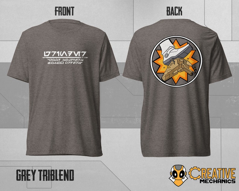 May include: A grey t-shirt with the text "L771A/V7" and a code underneath. The back of the shirt features a circular design with a white boot stepping on a small spaceship.