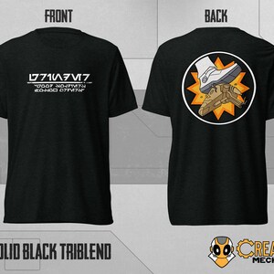 May include: Black t-shirt with a white graphic on the front that says "L771A3M7" and "Y2061 NO.J1MT4" and "EO-HOO 077V174". The back of the shirt has a white boot stepping on a spaceship with a yellow starburst behind it.
